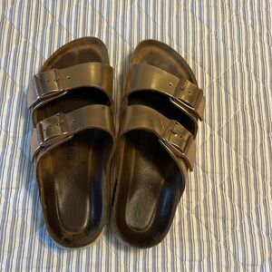 Birkenstock Arizona rose gold.   Fit like 7.5